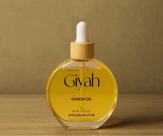Giyah onion oil bottle with dropper on wooden surface, hair care product